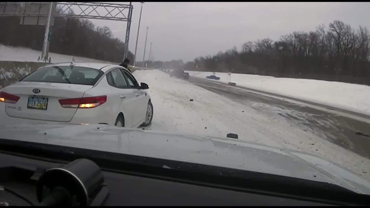 Video: Truck crashes into police cruiser on highway; officer runs to ...