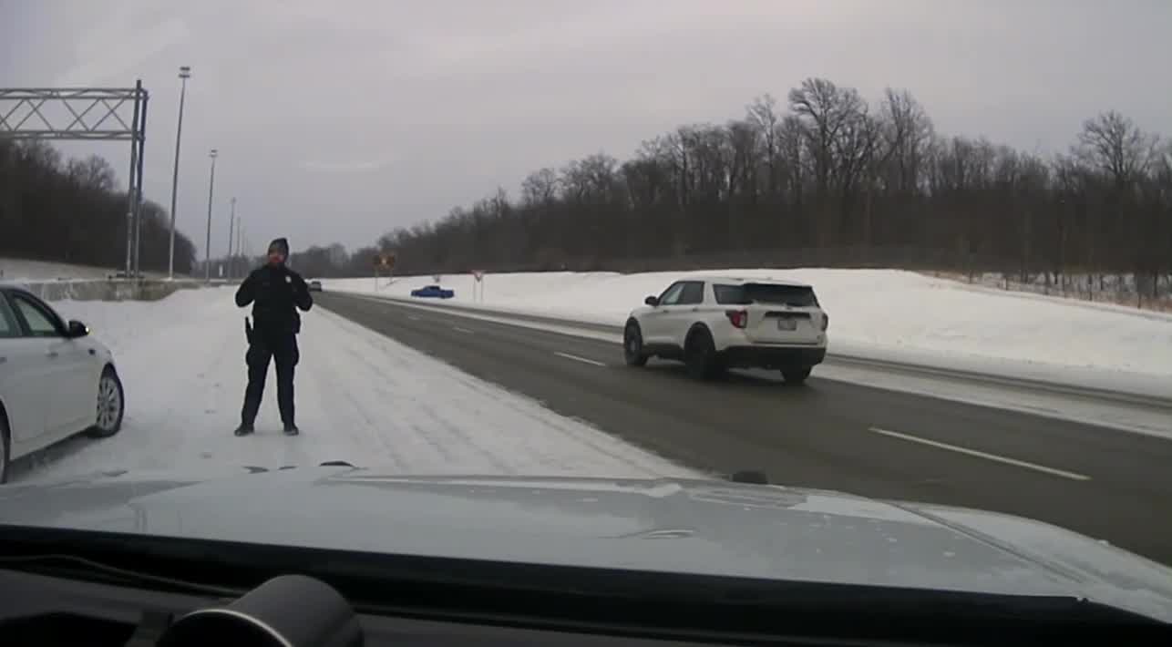 Video: Officer jumps out of way as truck crashes into police cruiser on ...